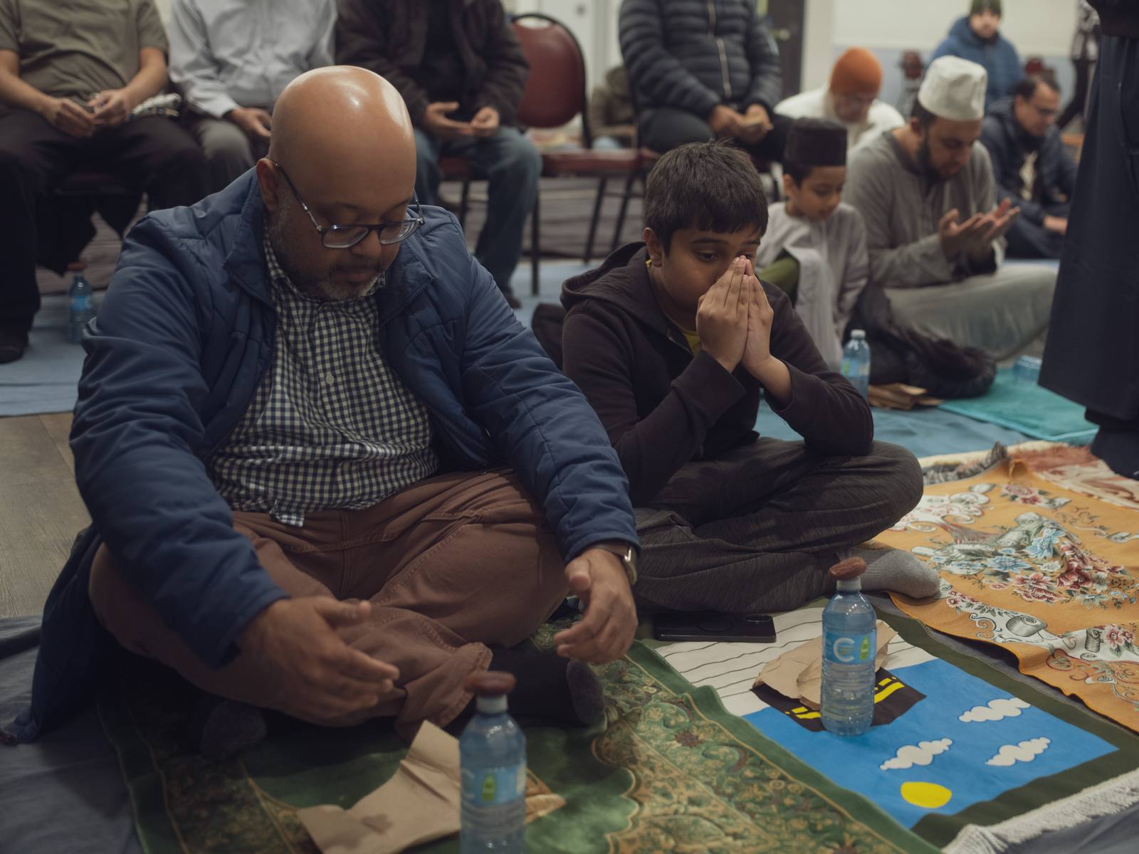 Father and son making du'a together